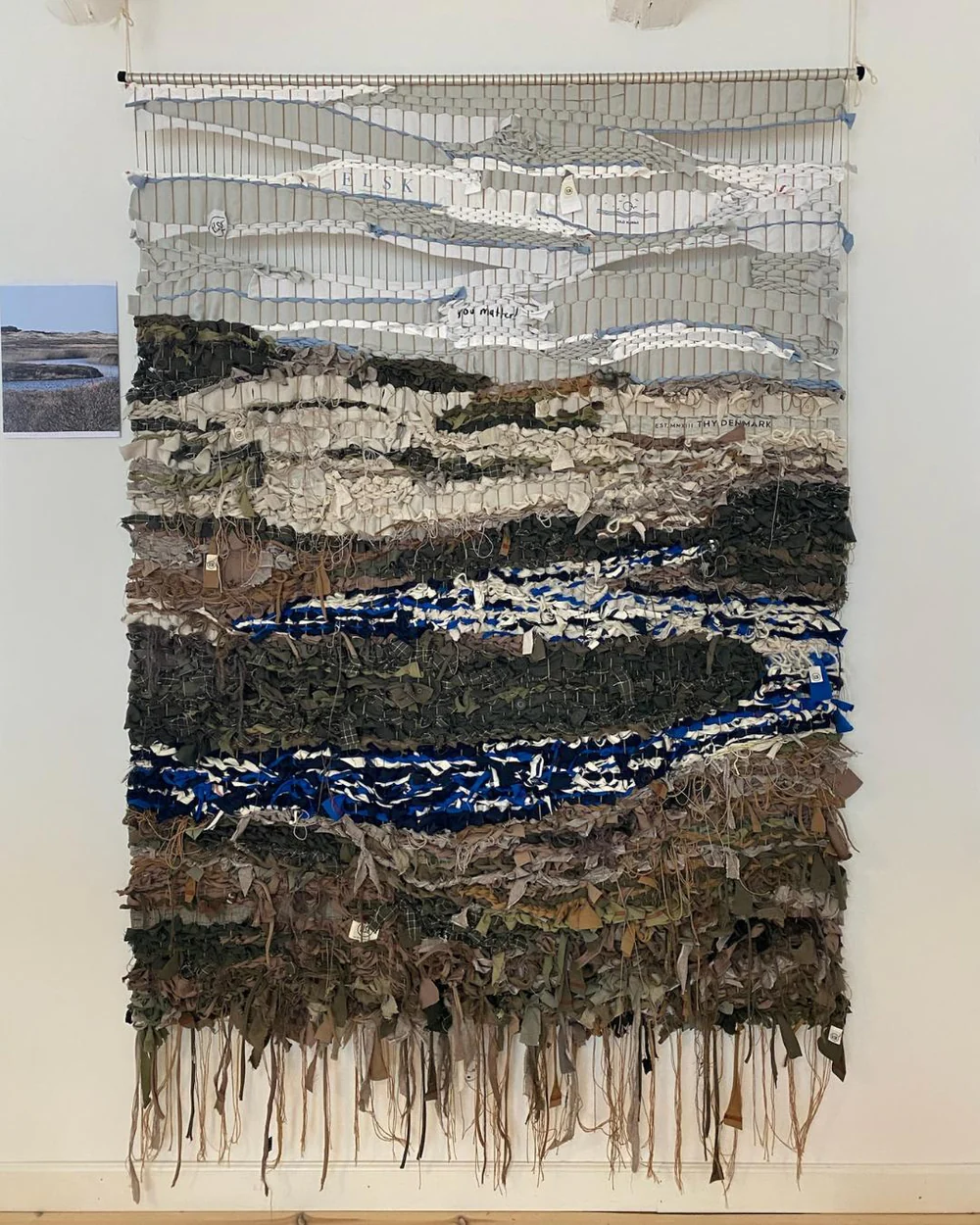 Wall art woven from worn ELSK garments, made with Inspired by Nature